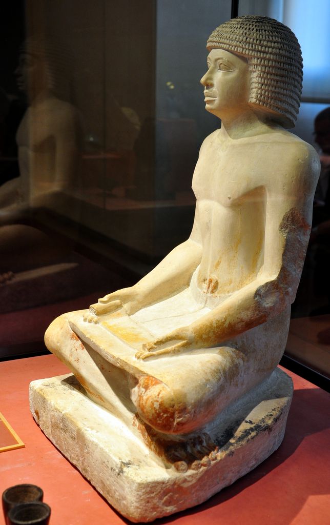 The statue of the scribe is an ancient Egyptian limestone sculpture of