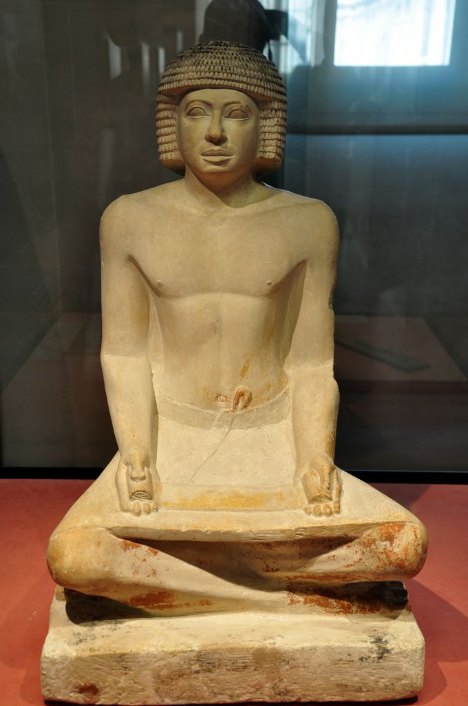 The statue of the scribe is an ancient Egyptian limestone sculpture of